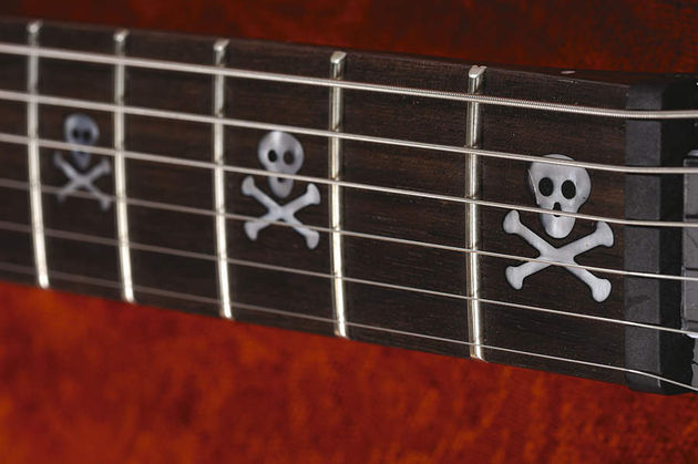 Skull fret markers, for metal kids only.